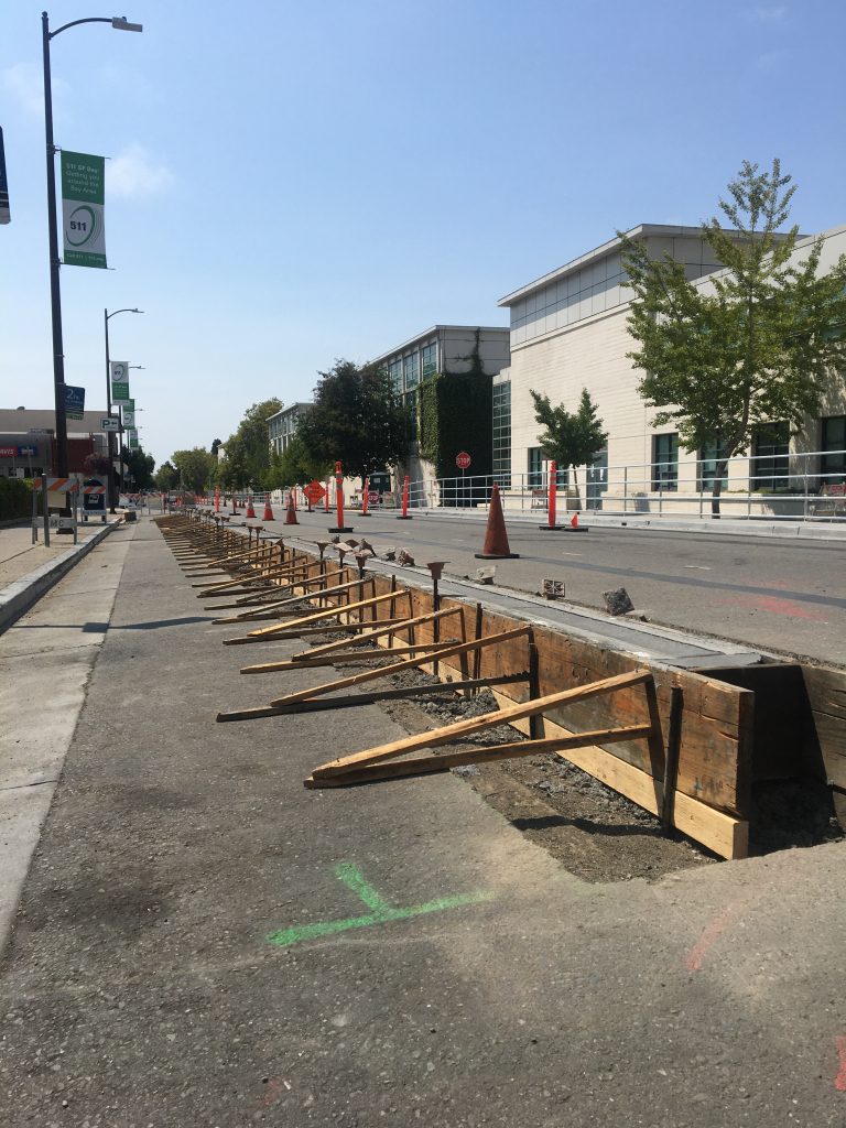 Protected bike lanes under construction on Milvia St in Berkeley, CA