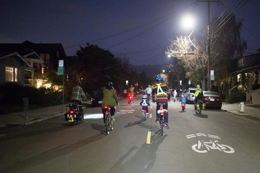 Children riding bikes at night - Kids Bike Parade