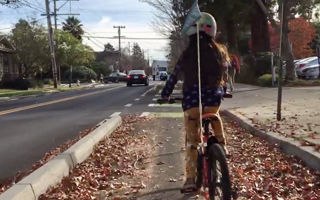 Child riding on Milvia Street Protected Bike Lane in Berkeley, CA