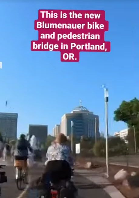 Riding a bike across the new Bluemenauer Bridge in Portland, OR