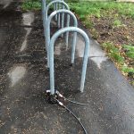 Bike rack with a cut cable lock. The bicycle was probably stolen.