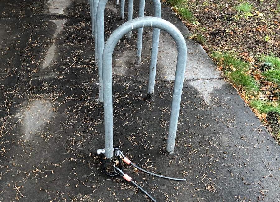Bike rack with a cut cable lock. The bicycle was probably stolen.