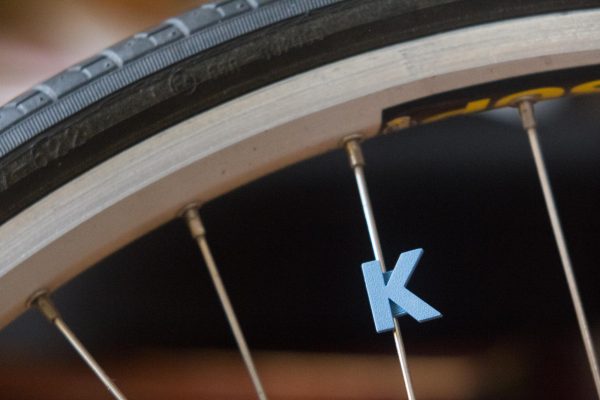 Bike wheel spoke decoration accessory in the shape of the letter K