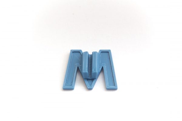 Bicycle spoke decoration in the shape of the letter M