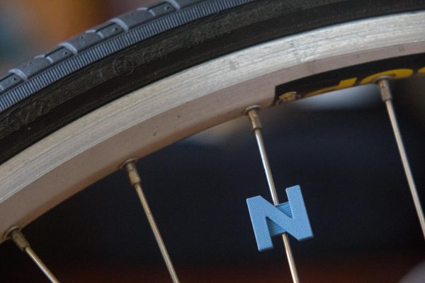 Bike spoke decoration in the shape of the letter "N"