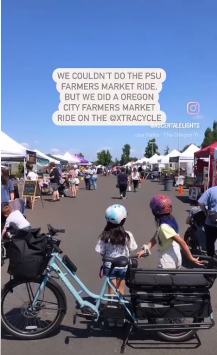 The Xtracycle cargo bike with kids at the Oregon City Farmer's Market