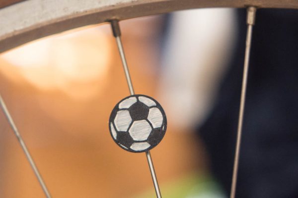 Soccer ball spoke charm for a bicycle