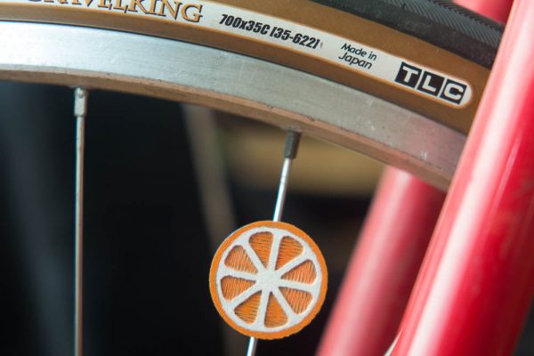 Orange citrus slice spoke decoration for bike wheels