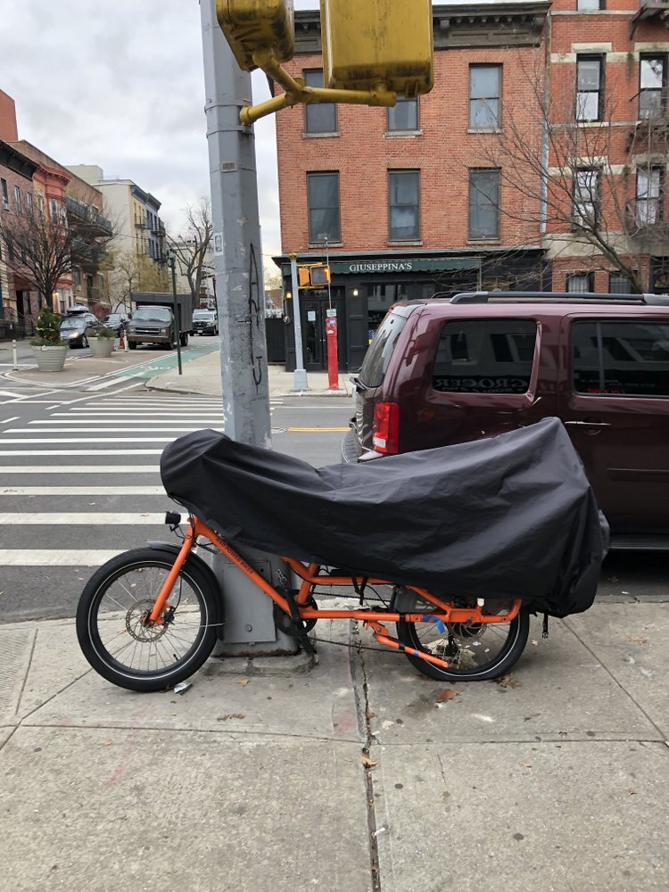 Orange Radwagon bike with a partial cover