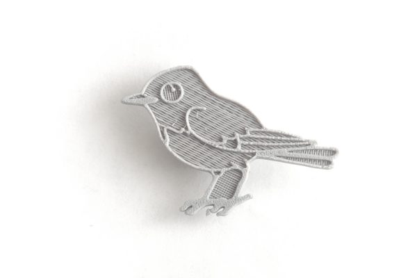 grey bird spoke card decoration on a bicycle wheel