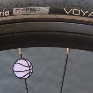 Violet and black (Lavender) basketball spoke decoration on a bicycle wheel Golden State Valkyries colors
