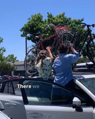 Removing bikes from a roof rack of a car