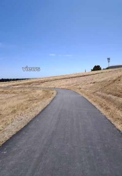Delta De Anza Views: brown grass, black trail, deep blue skies